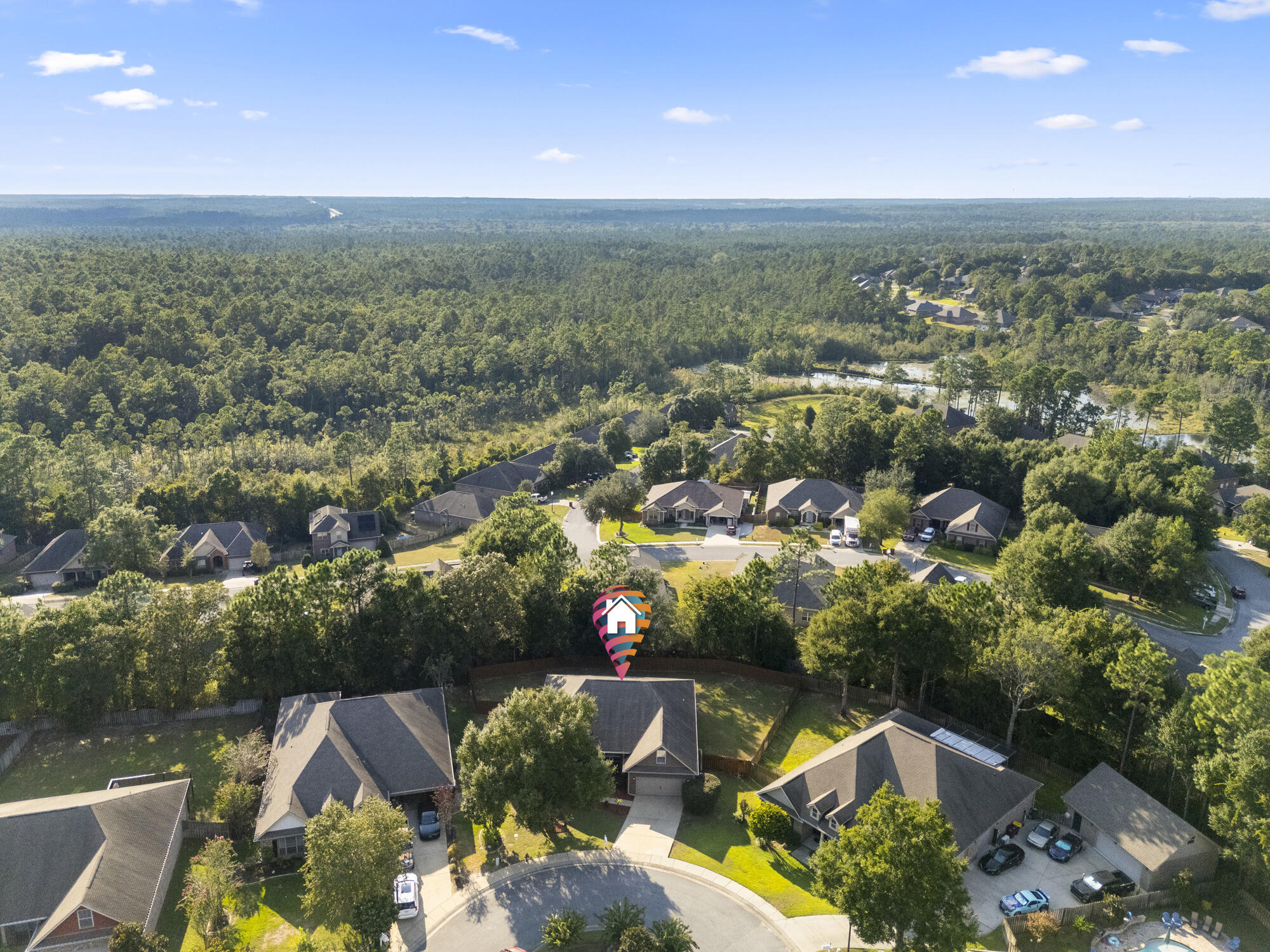 517 Pheasant Trail Crestview, FL 32536 - Photo 55 of 64 an aerial view of a house with a yard and lake view