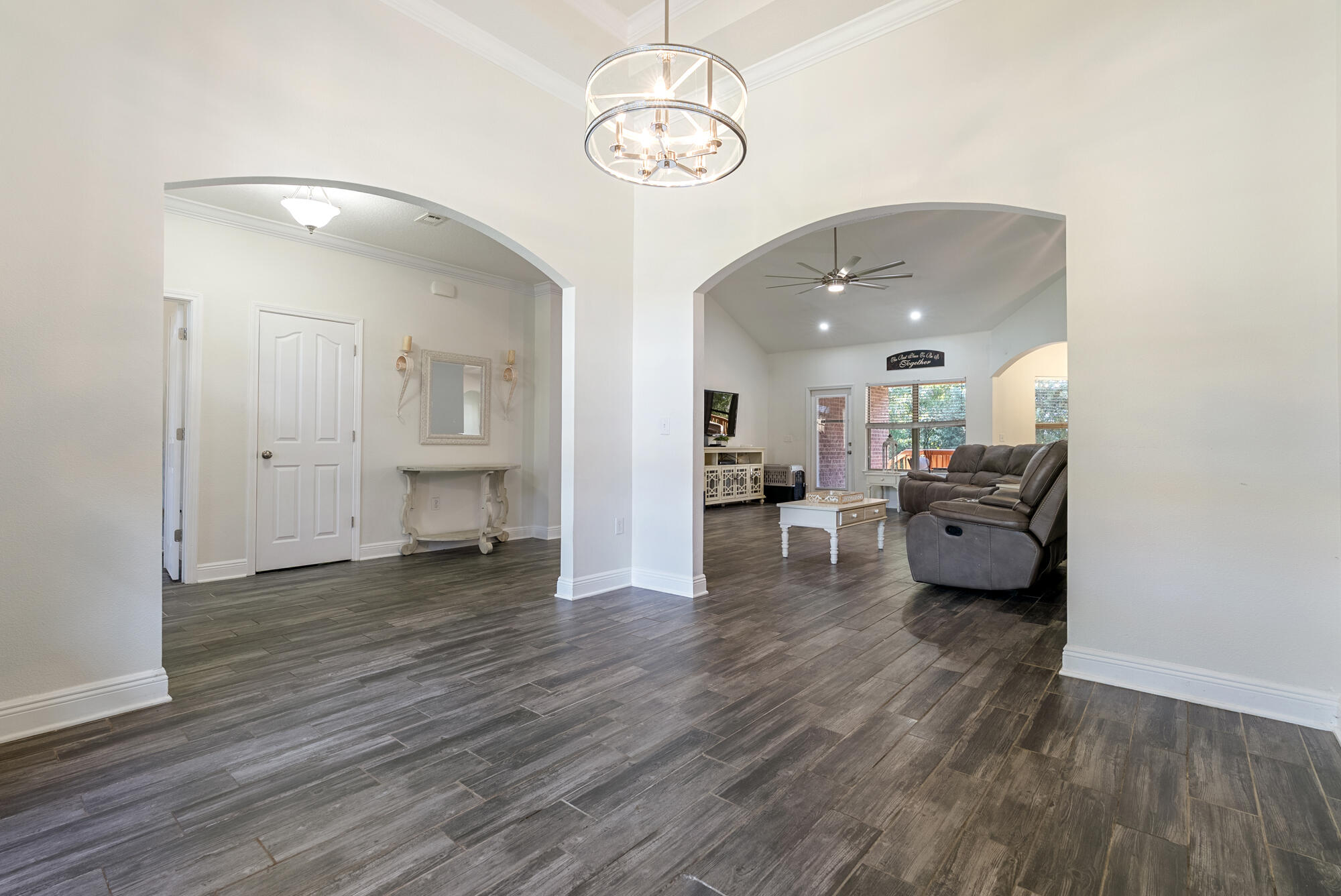 517 Pheasant Trail Crestview, FL 32536 - Photo 6 of 64 a living room with furniture and a chandelier