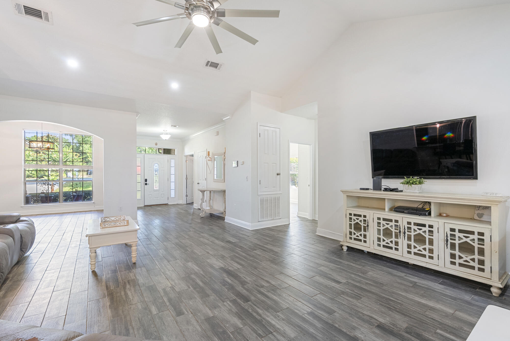 517 Pheasant Trail Crestview, FL 32536 - Photo 10 of 64 a living room with furniture and a flat screen tv