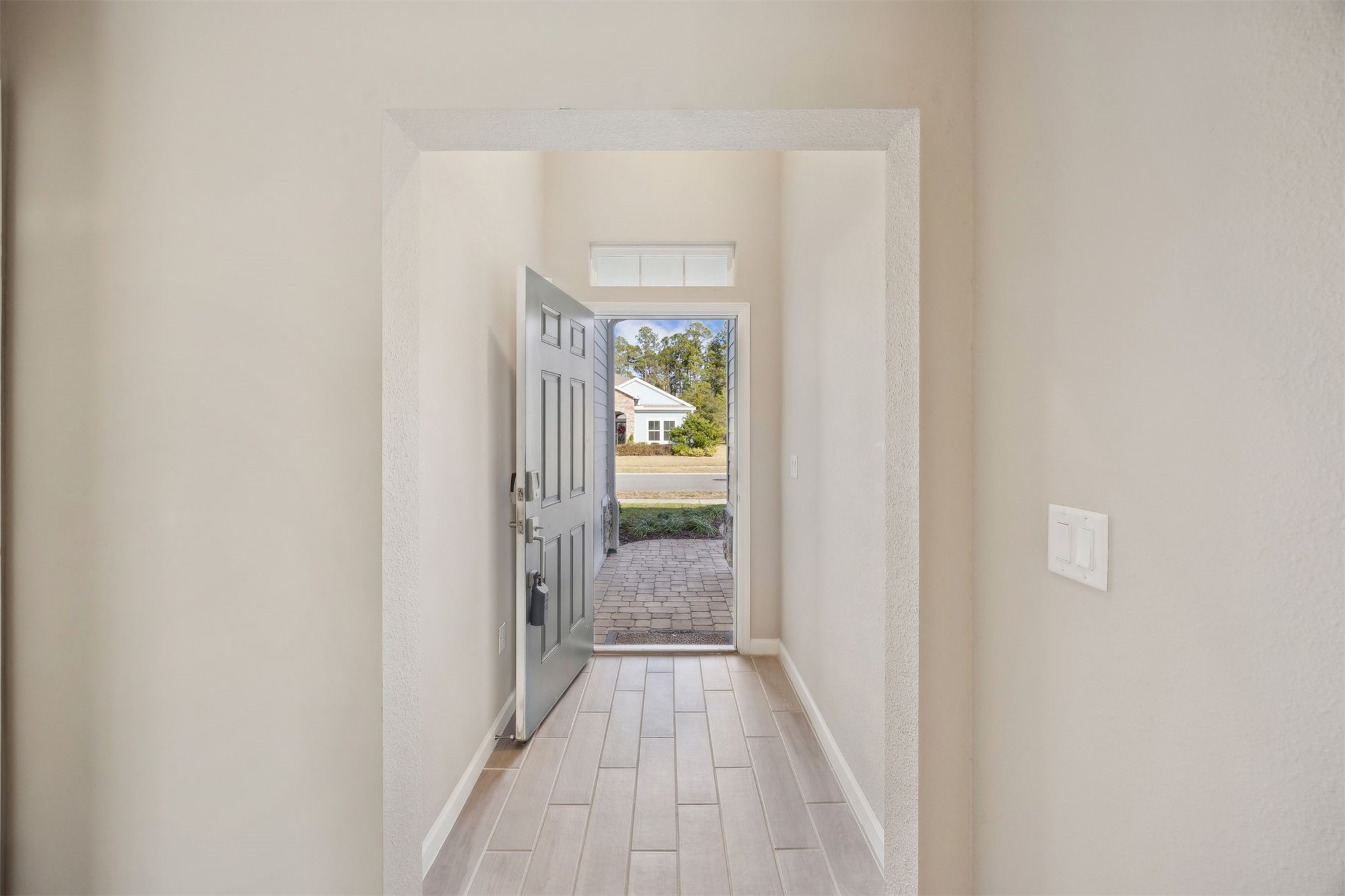 85237 Fall River Parkway Fernandina Beach, FL 32034 - Photo 11 of 88 a view of a hallway with wooden floor