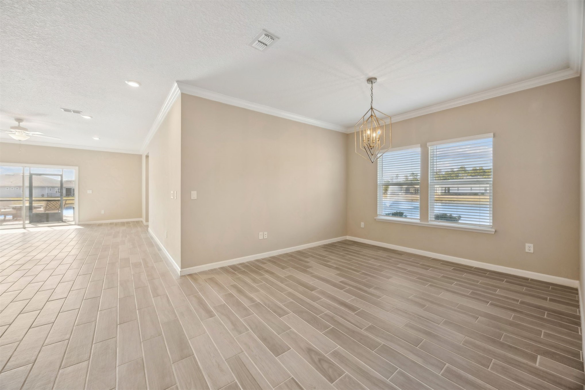 85237 Fall River Parkway Fernandina Beach, FL 32034 - Photo 12 of 88 wooden floor in an empty room with a window