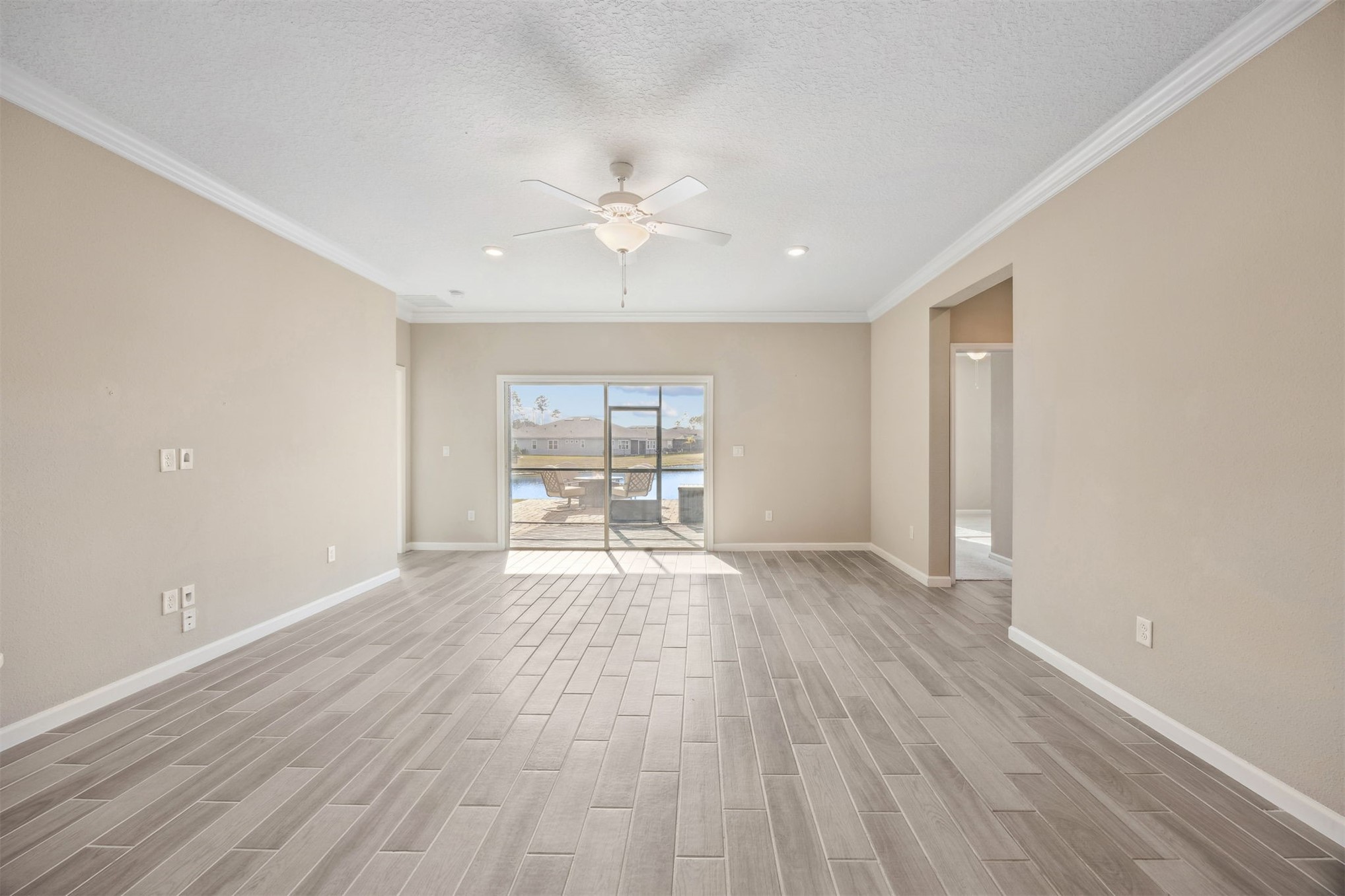 85237 Fall River Parkway Fernandina Beach, FL 32034 - Photo 27 of 88 a view of empty room with wooden floor and fan