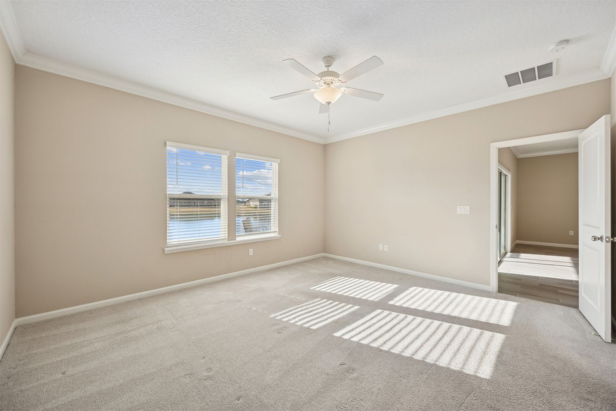 85237 Fall River Parkway Fernandina Beach, FL 32034 - Photo 30 of 88 a view of an empty room with chandelier fan and fire place