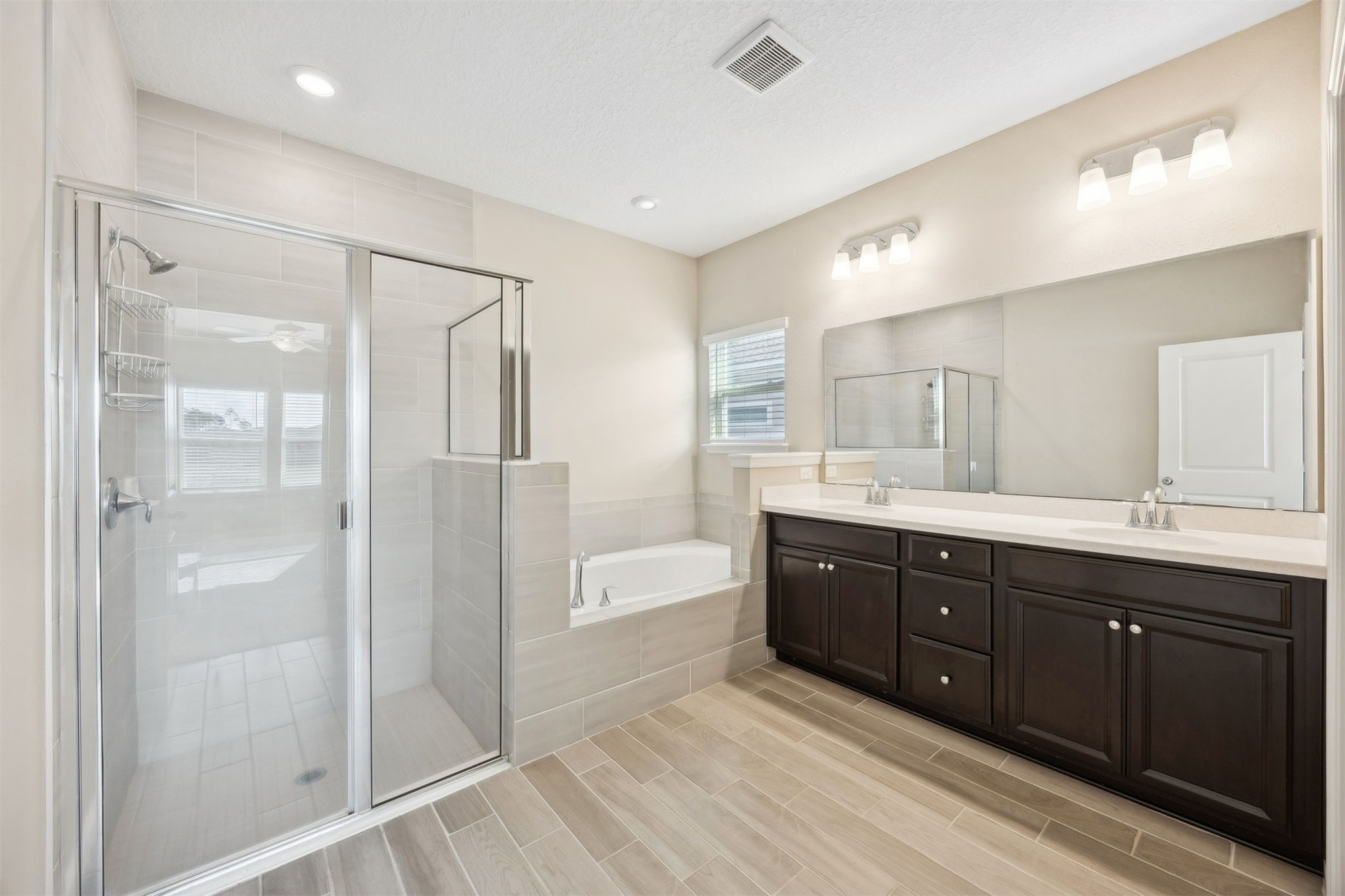 85237 Fall River Parkway Fernandina Beach, FL 32034 - Photo 31 of 88 a spacious bathroom with a shower sink double and mirror