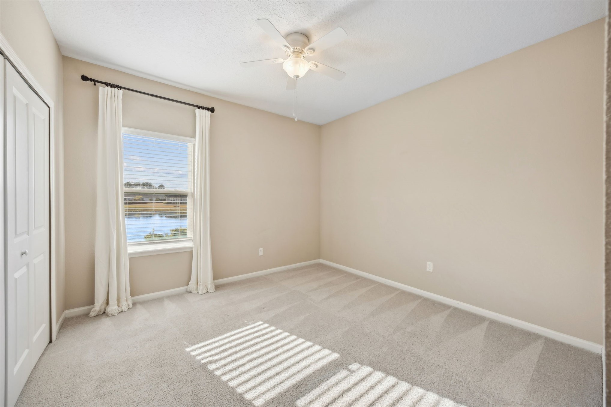 85237 Fall River Parkway Fernandina Beach, FL 32034 - Photo 33 of 88 a view of an empty room with a window