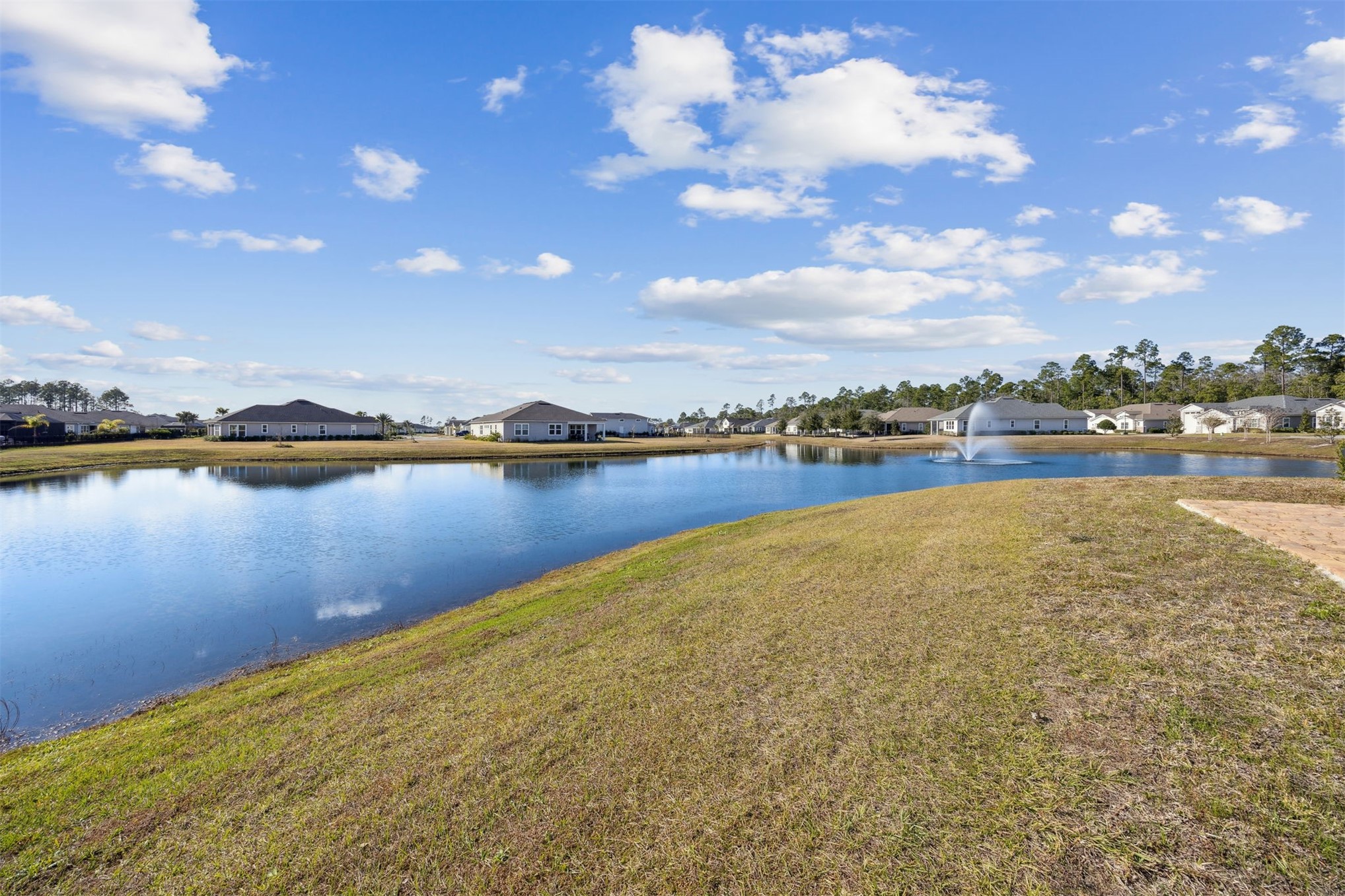85237 Fall River Parkway Fernandina Beach, FL 32034 - Photo 48 of 88 a view of a lake with houses in the back