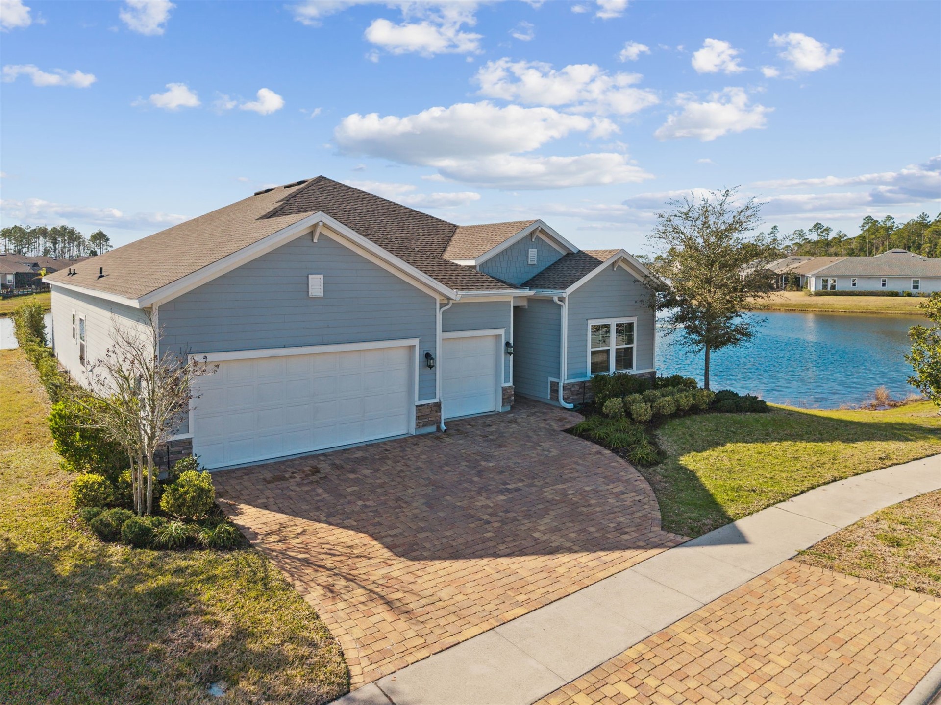 85237 Fall River Parkway Fernandina Beach, FL 32034 - Photo 52 of 88 a front view of a house with garden