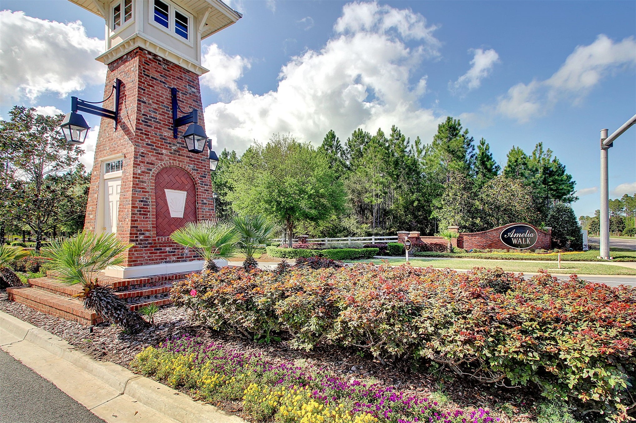 85237 Fall River Parkway Fernandina Beach, FL 32034 - Photo 61 of 88 a backyard of a house with lots of green space and lake view
