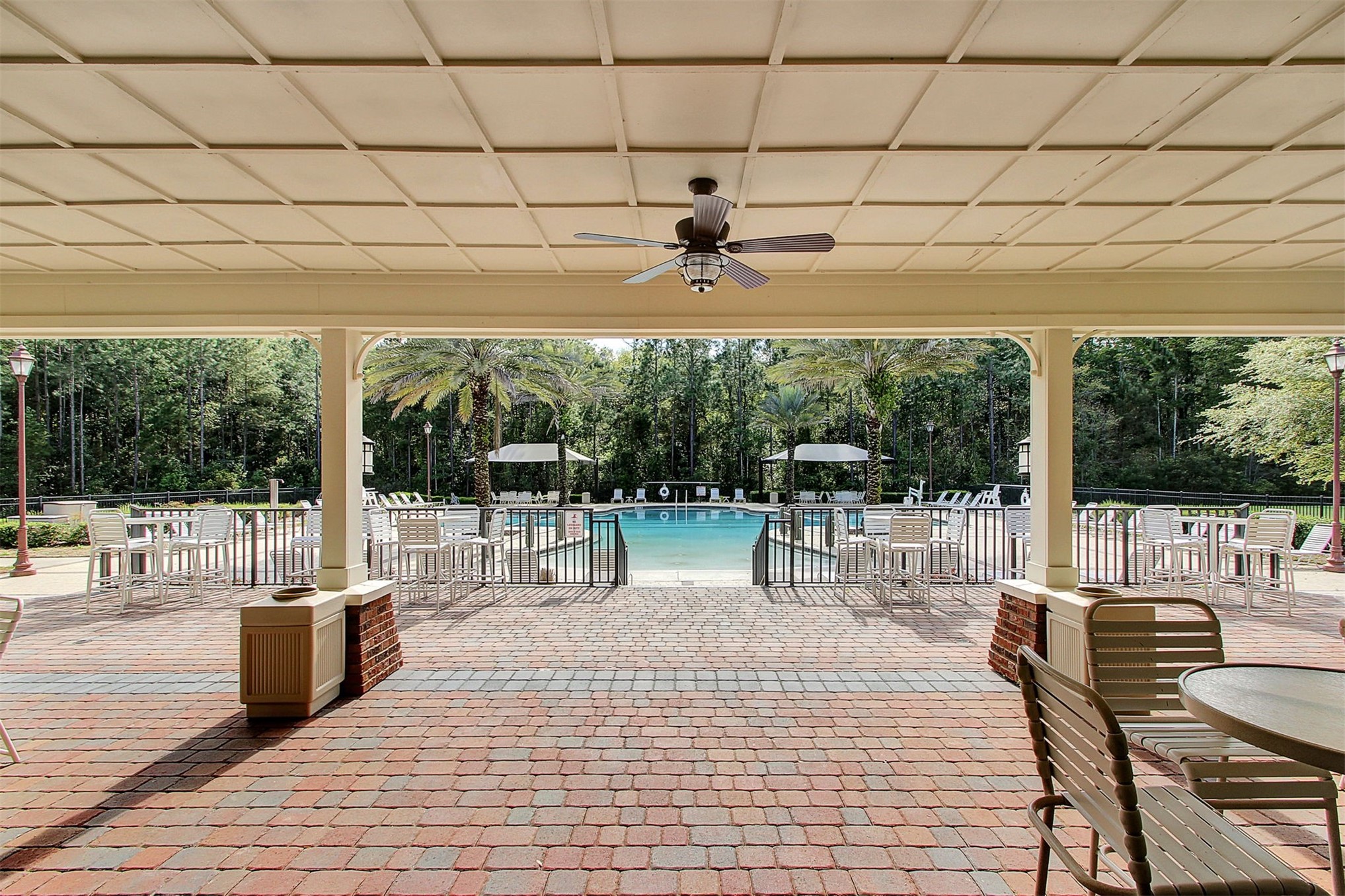 85237 Fall River Parkway Fernandina Beach, FL 32034 - Photo 67 of 88 a view of a patio with dining table and chairs
