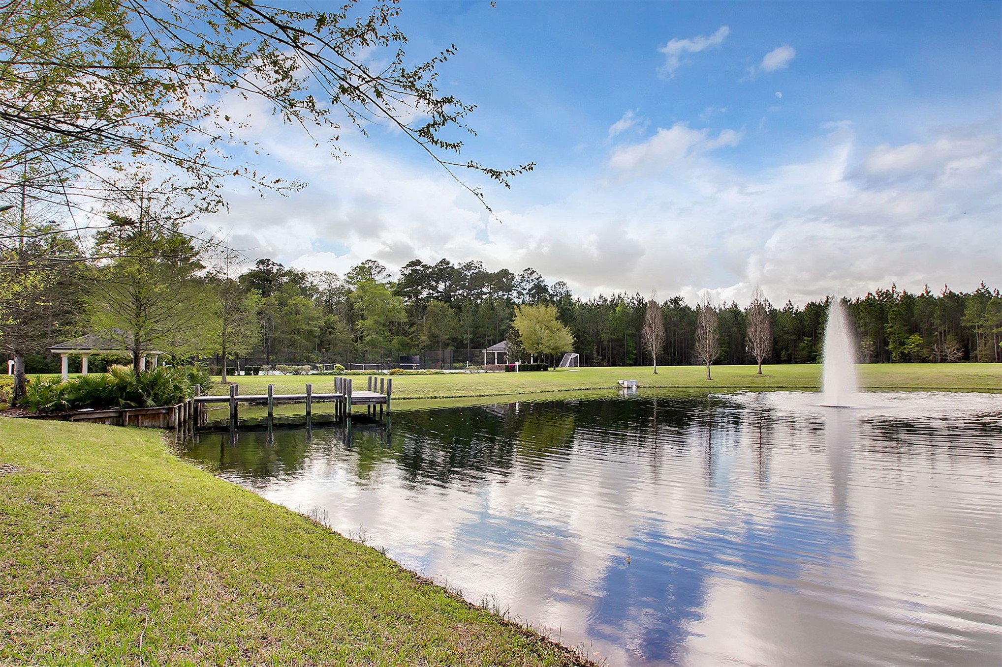 85237 Fall River Parkway Fernandina Beach, FL 32034 - Photo 84 of 88 a view of a lake with boats and trees in the background