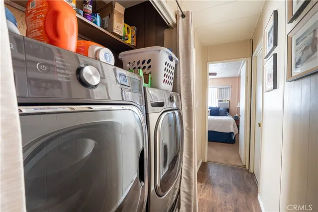 a large bedroom with a bed and a chandelier