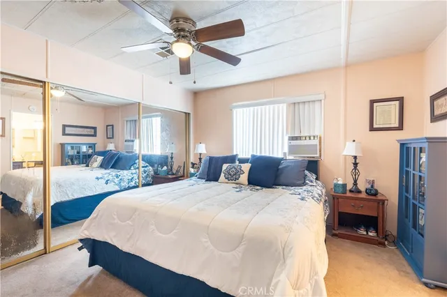 a bed room with a bed and a dresser