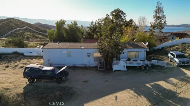 a backyard of a house with yard fire pit and outdoor seating