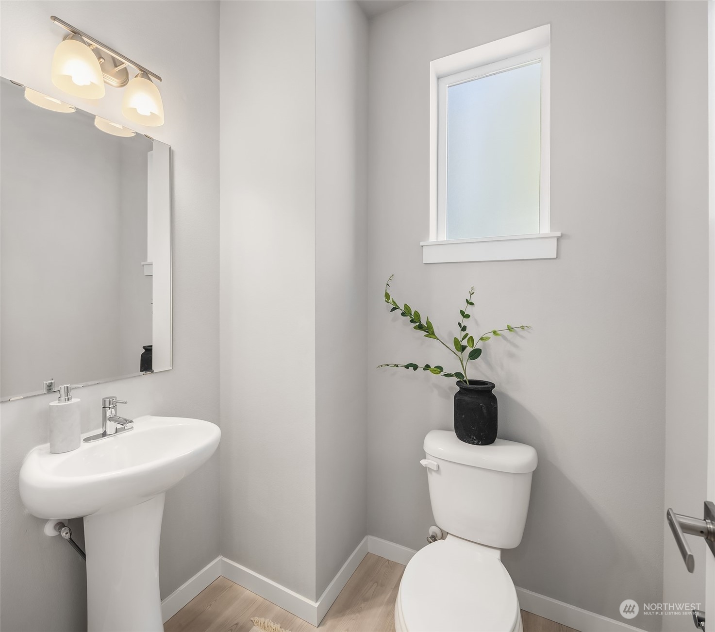 15720 Meadow Road, Unit C2 Lynnwood, WA 98087 - Photo 12 of 23 a bathroom with a toilet sink and mirror