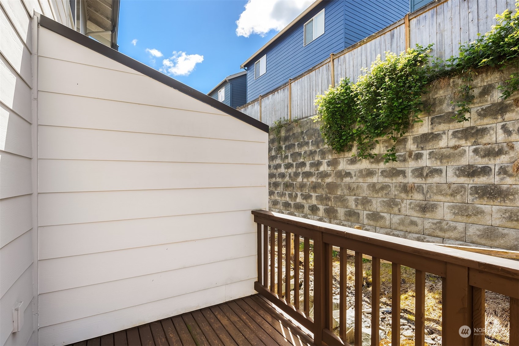 15720 Meadow Road, Unit C2 Lynnwood, WA 98087 - Photo 14 of 23 a view of a balcony with wooden fence