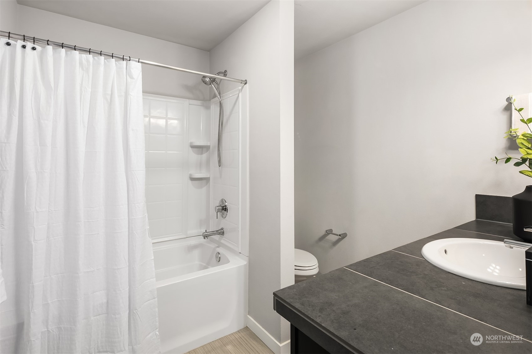 15720 Meadow Road, Unit C2 Lynnwood, WA 98087 - Photo 16 of 23 a bathroom with a granite countertop sink toilet and shower
