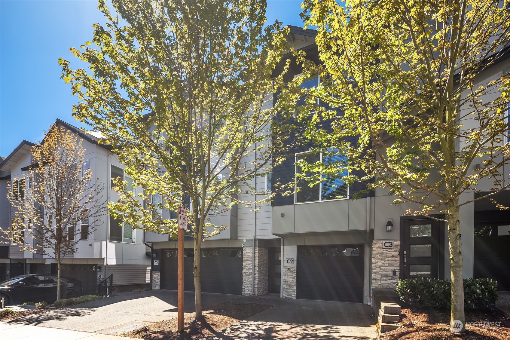 15720 Meadow Road, Unit C2 Lynnwood, WA 98087 - Photo 2 of 23 a view of a house with a tree