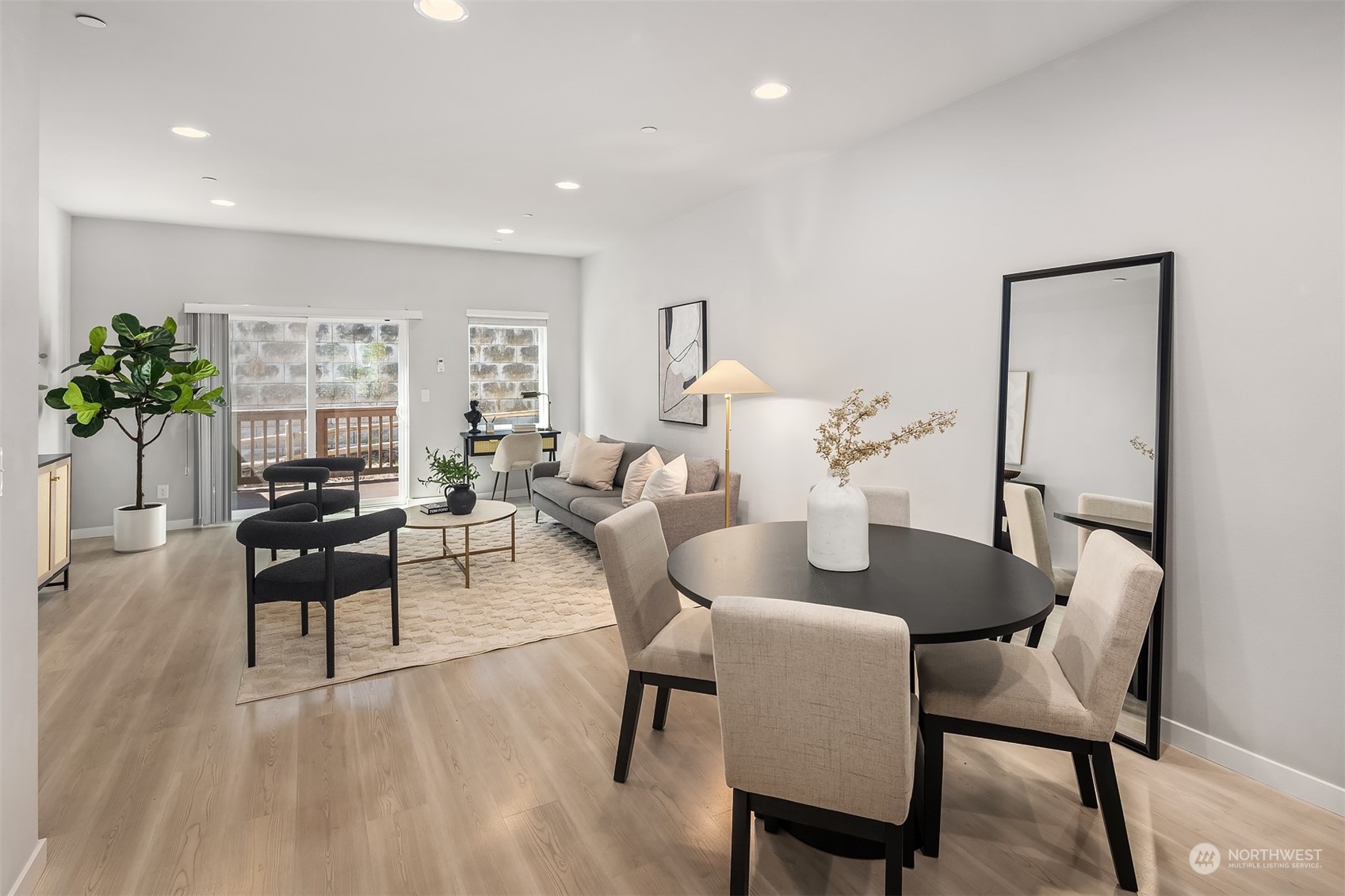 15720 Meadow Road, Unit C2 Lynnwood, WA 98087 - Photo 7 of 23 a view of a dining room with furniture and wooden floor