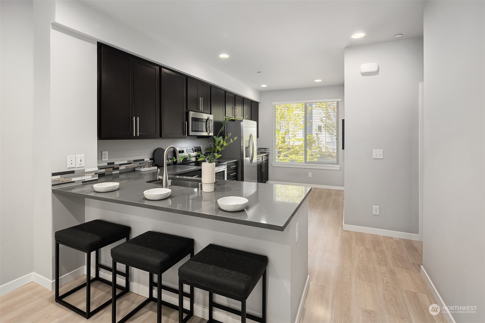 15720 Meadow Road, Unit C2 Lynnwood, WA 98087 - Photo 8 of 23 a kitchen with a sink cabinets and window