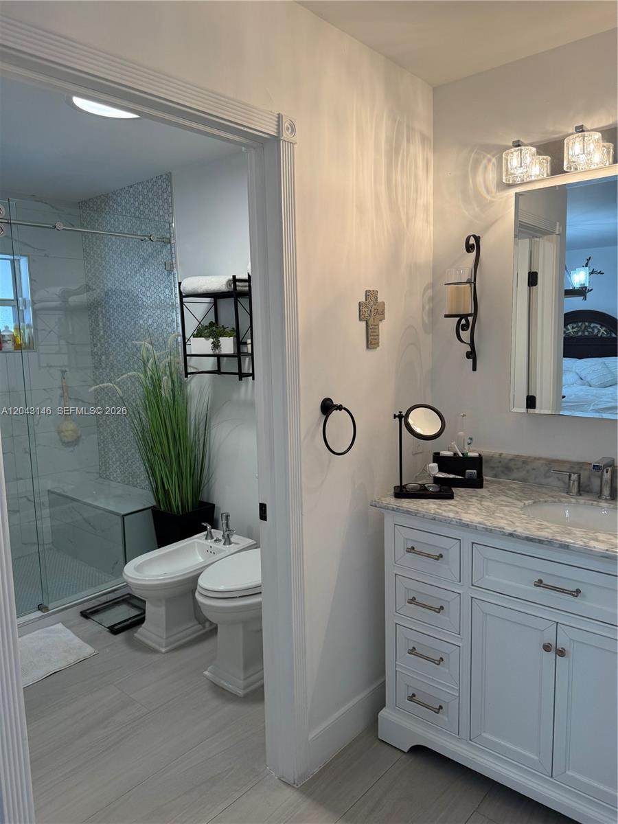 4947 Southwest 143rd Avenue Miami, FL 33175 - Photo 17 of 19 Master vanity, sink, and bathroom area.