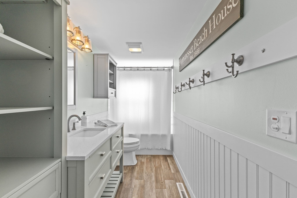 2 Uncle Edwards Road Mashpee, MA 02649 - Photo 20 of 42 a bathroom with a double vanity sink mirror and shower