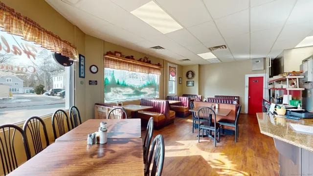 a view of a dining room with furniture window and outside view