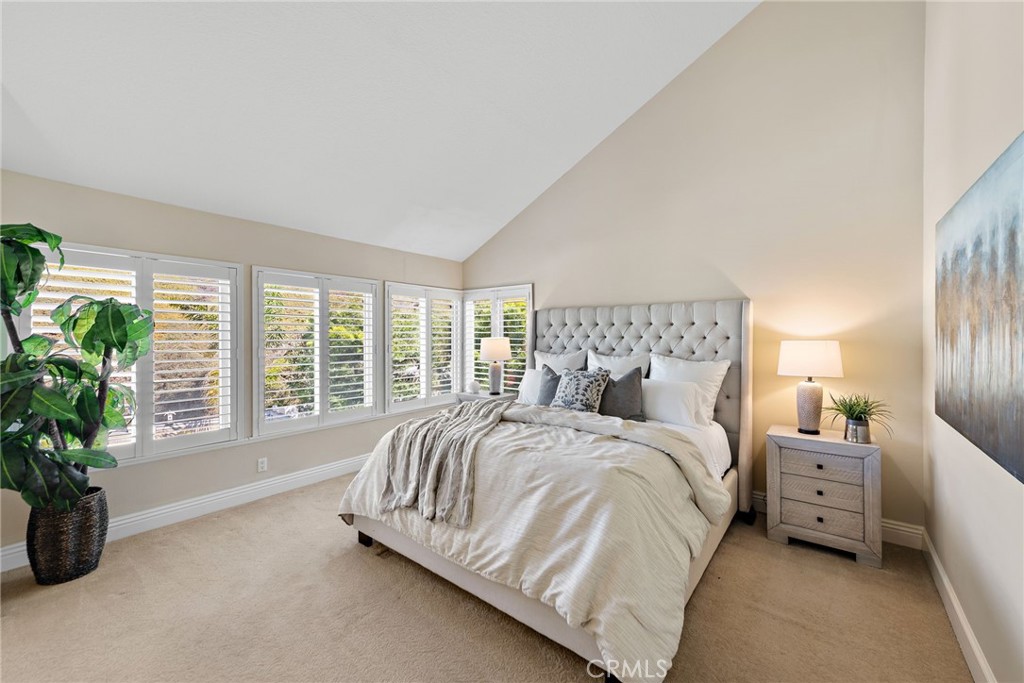 2170 Via Teca San Clemente, CA 92673 - Photo 12 of 20 a spacious bedroom with a bed and a potted plant