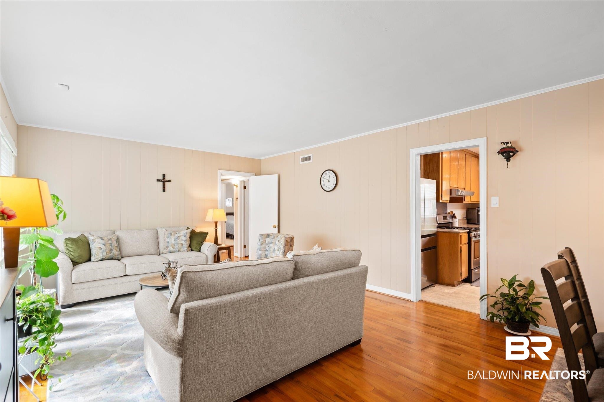 162 Bit And Spur Terrace Mobile, AL 36608 - Photo 3 of 29 Living room with light hardwood / wood-style flooring, a healthy amount of sunlight, and crown molding
