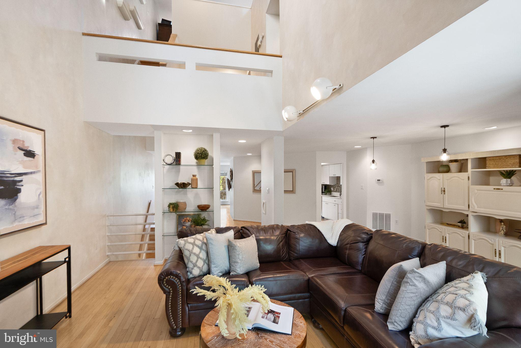 2013 Turtle Pond Drive Reston, VA 20191 - Photo 13 of 62 a living room with furniture and a wooden floor