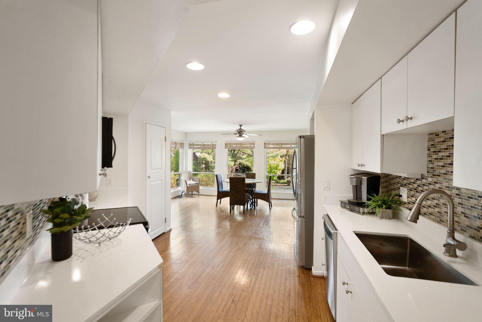 2013 Turtle Pond Drive Reston, VA 20191 - Photo 15 of 62 a kitchen with sink refrigerator and dining table
