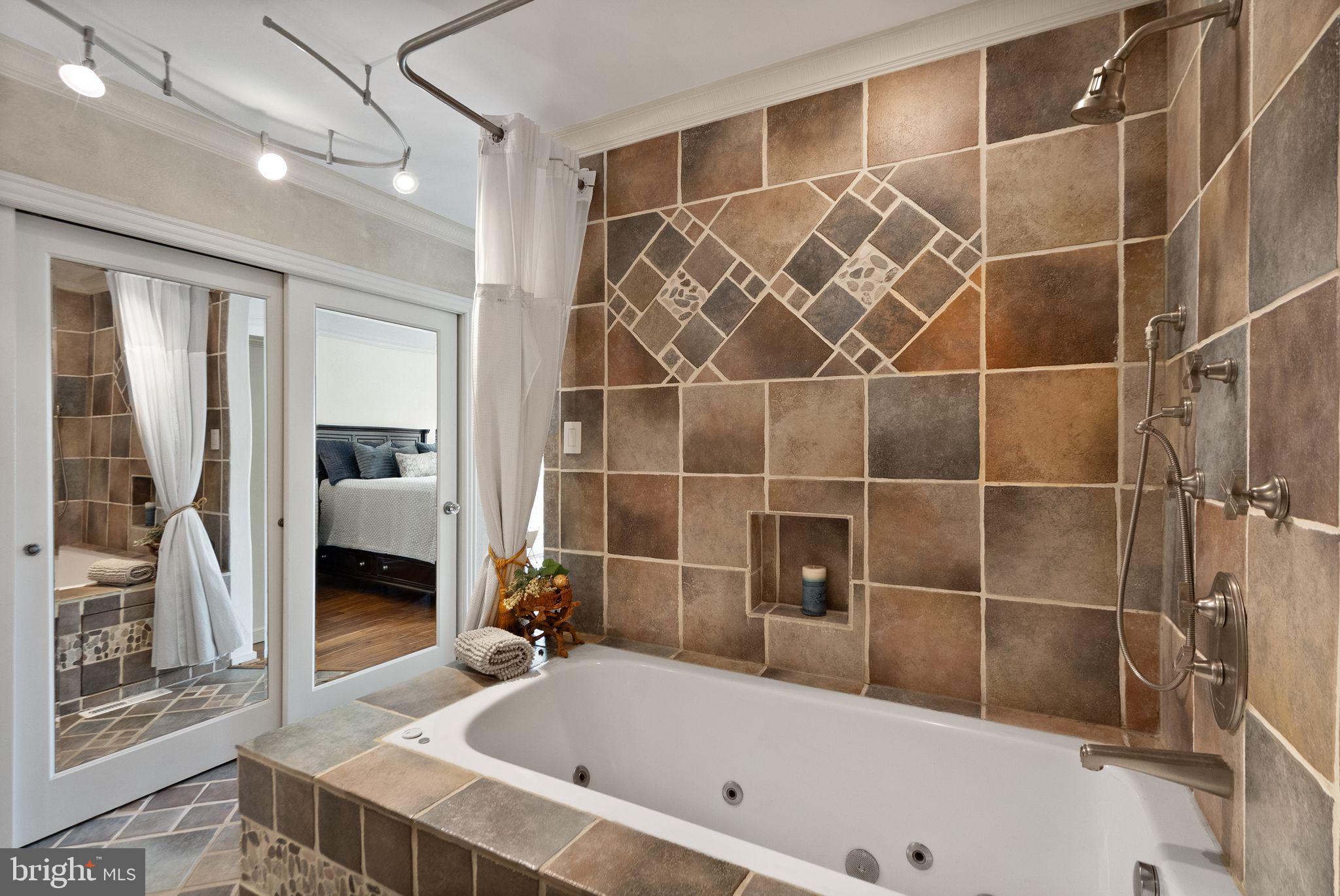 2013 Turtle Pond Drive Reston, VA 20191 - Photo 26 of 62 a bathroom with a bathtub and a shower