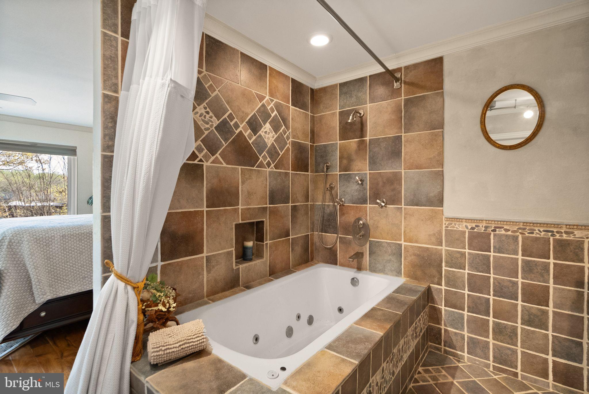 2013 Turtle Pond Drive Reston, VA 20191 - Photo 27 of 62 a bathroom with a tub and a shower