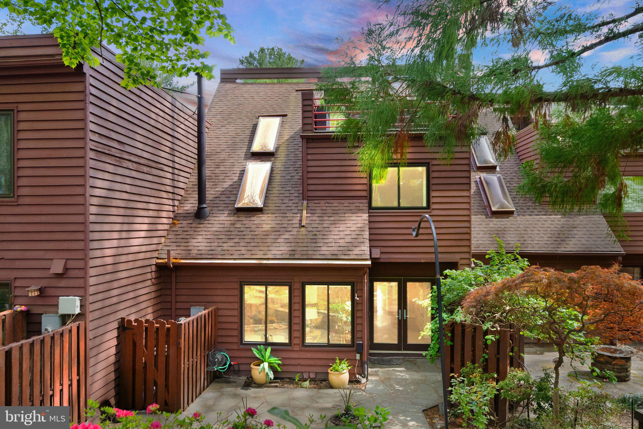 2013 Turtle Pond Drive Reston, VA 20191 - Photo 3 of 62 a front view of a house with garden