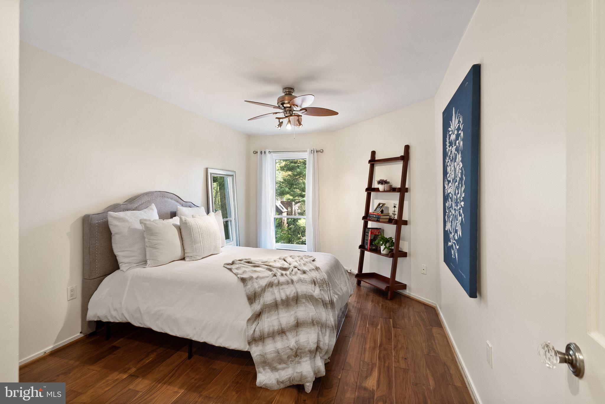 2013 Turtle Pond Drive Reston, VA 20191 - Photo 37 of 62 a bedroom with a bed and a book shelf