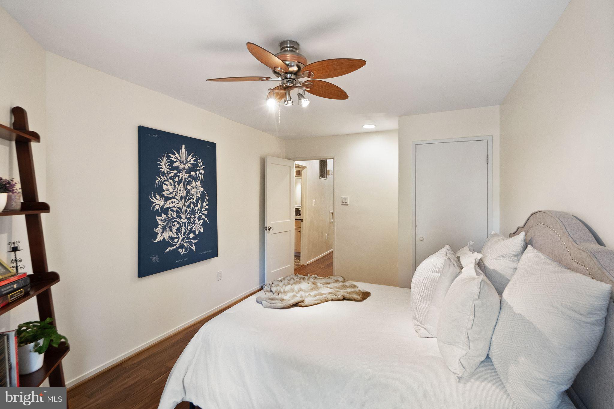 2013 Turtle Pond Drive Reston, VA 20191 - Photo 38 of 62 a bedroom with a large bed and a ceiling fan