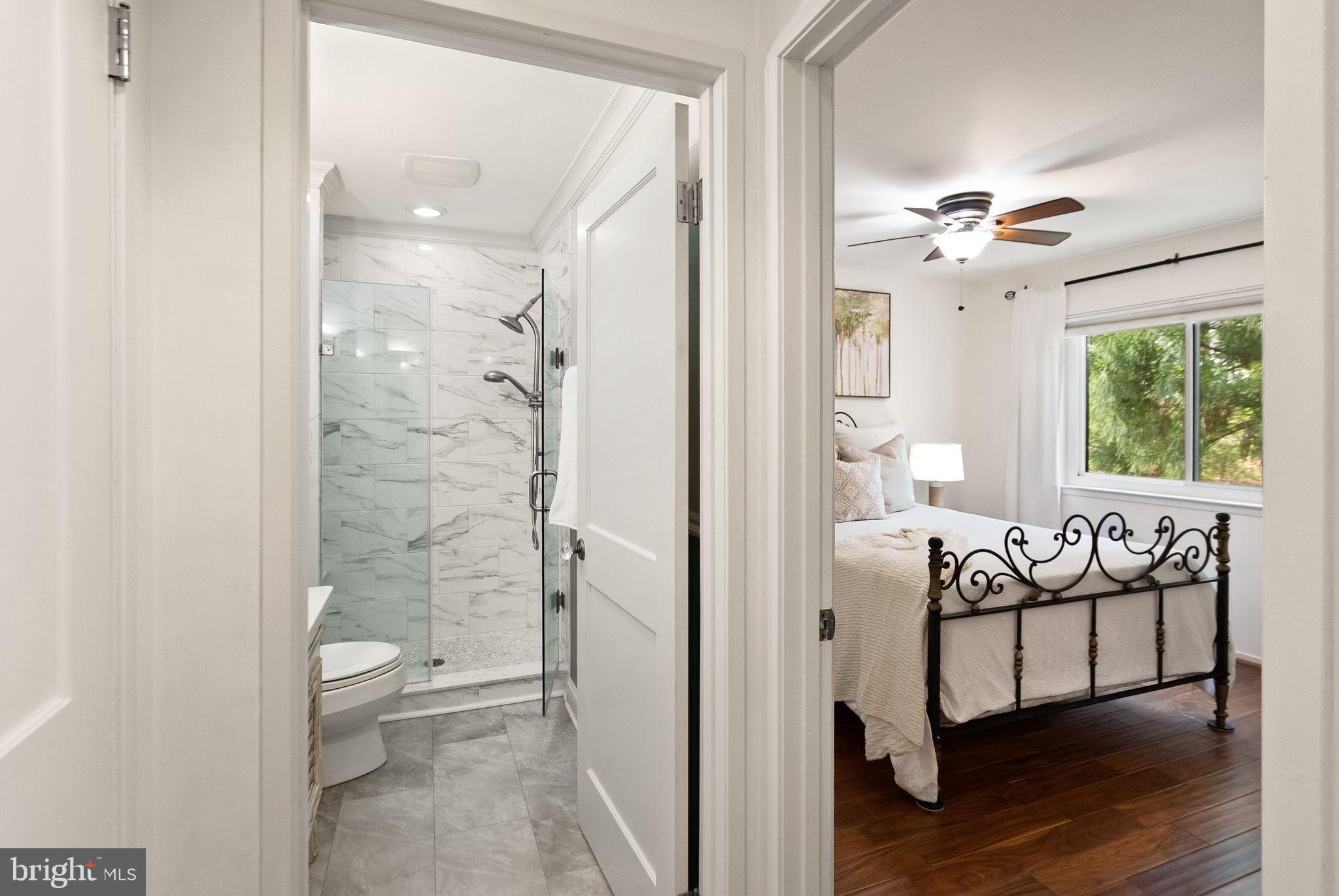 2013 Turtle Pond Drive Reston, VA 20191 - Photo 39 of 62 a spacious bathroom with a glass door shower and a toilet