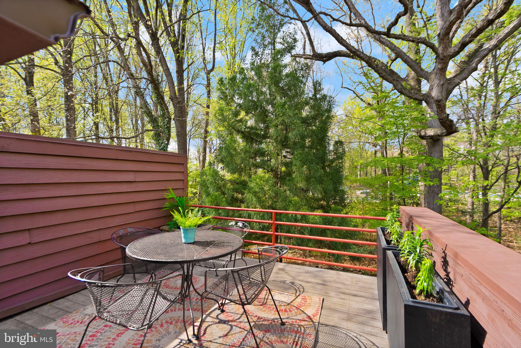2013 Turtle Pond Drive Reston, VA 20191 - Photo 51 of 62 a view of a chairs and table in the backyard