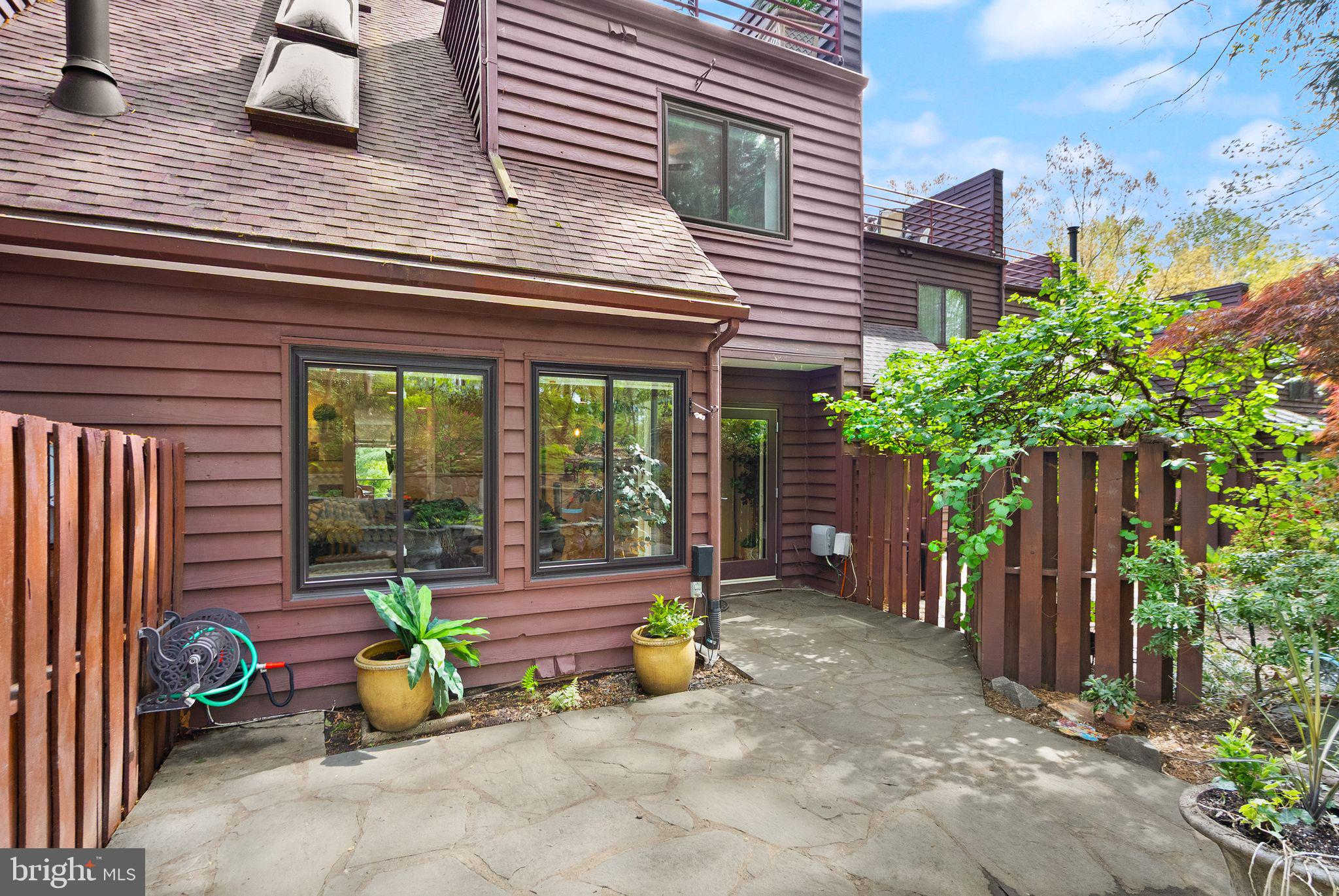 2013 Turtle Pond Drive Reston, VA 20191 - Photo 55 of 62 a view of a patio with chairs and potted plants