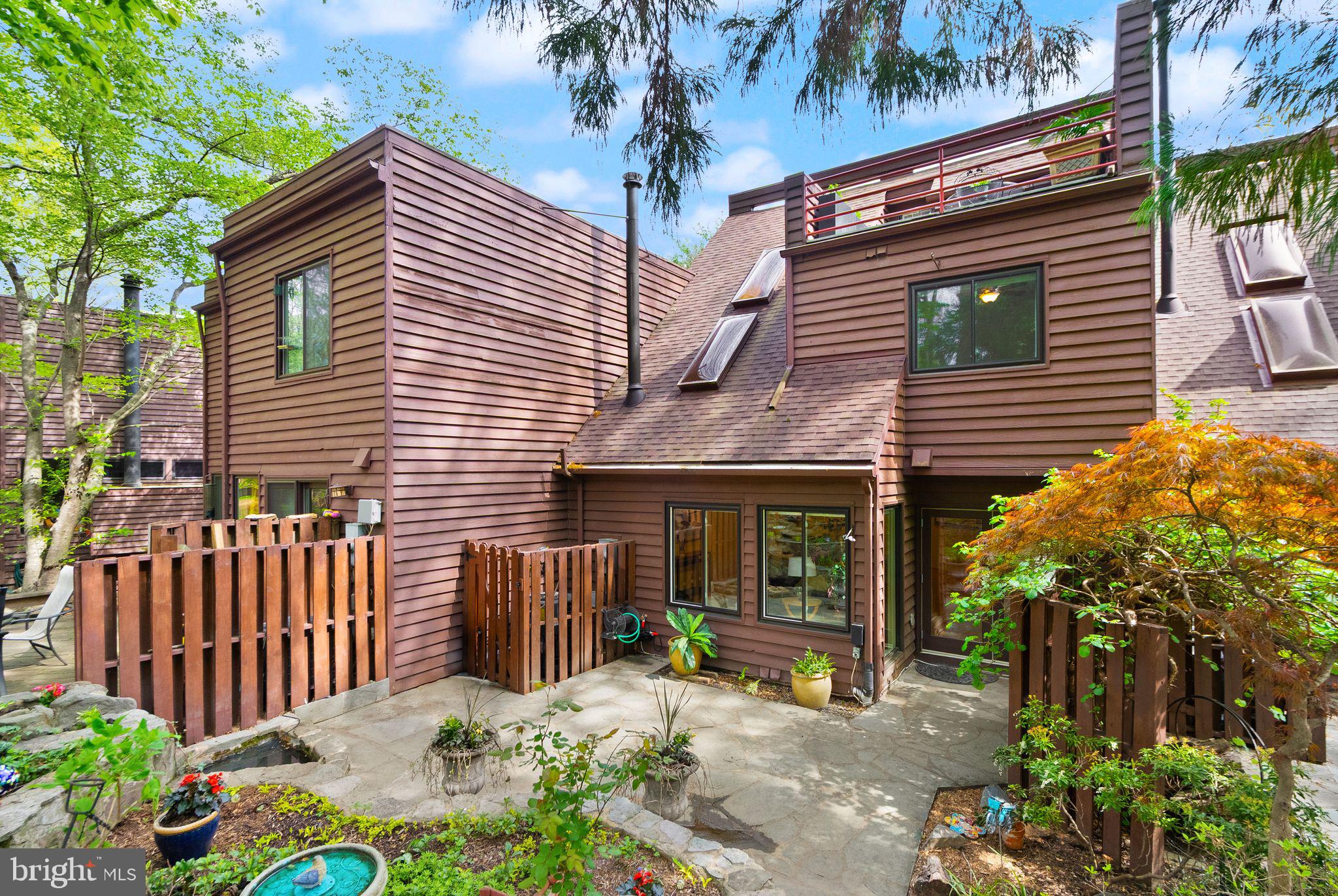 2013 Turtle Pond Drive Reston, VA 20191 - Photo 58 of 62 a front view of a house with a garden