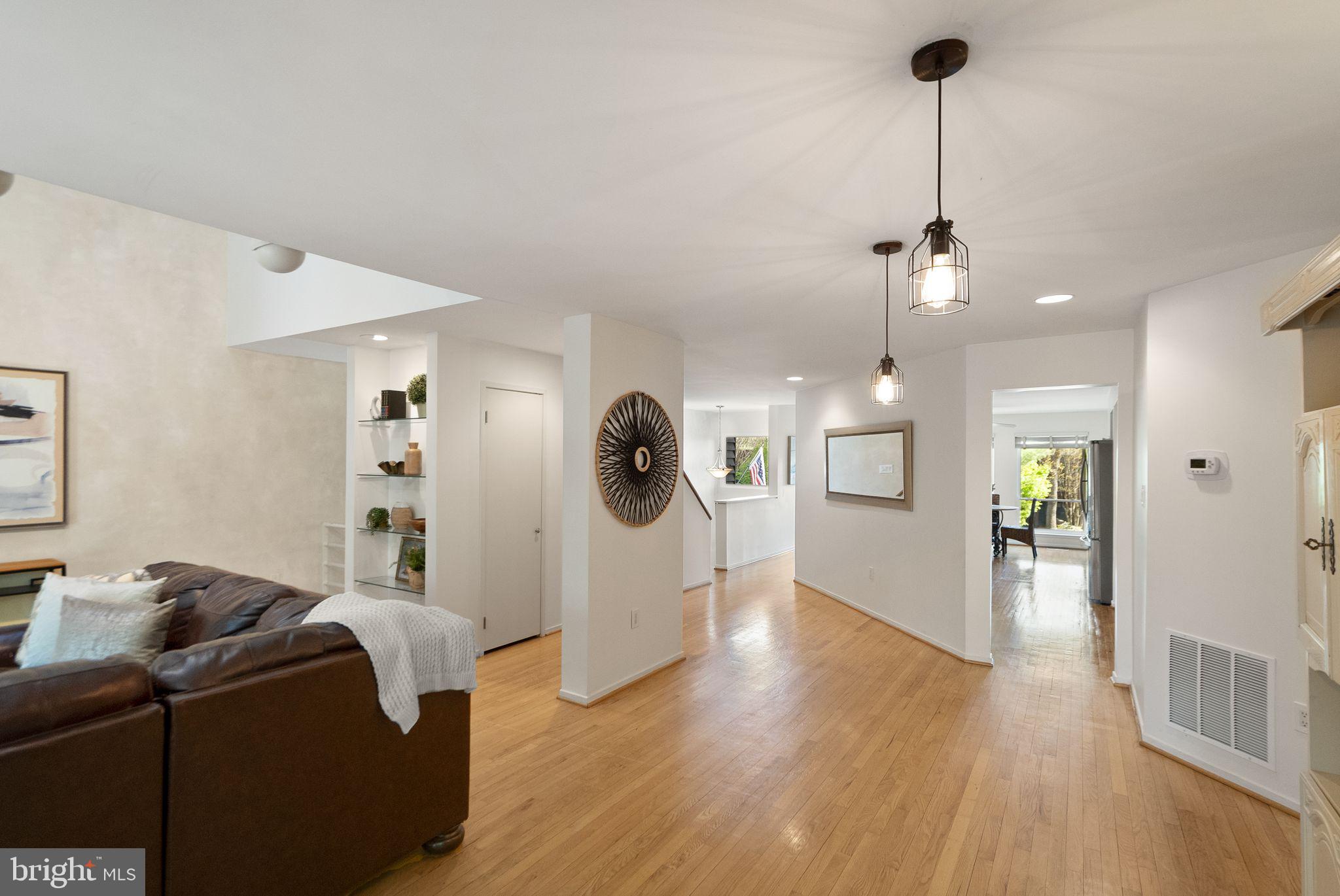 2013 Turtle Pond Drive Reston, VA 20191 - Photo 10 of 62 a living room with furniture and a wooden floor