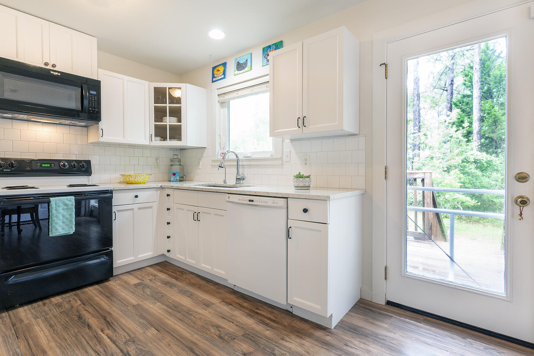 140 East Wild Blueberry Way Santa Rosa Beach, FL 32459 - Photo 11 of 48 a kitchen with a stove window and cabinets
