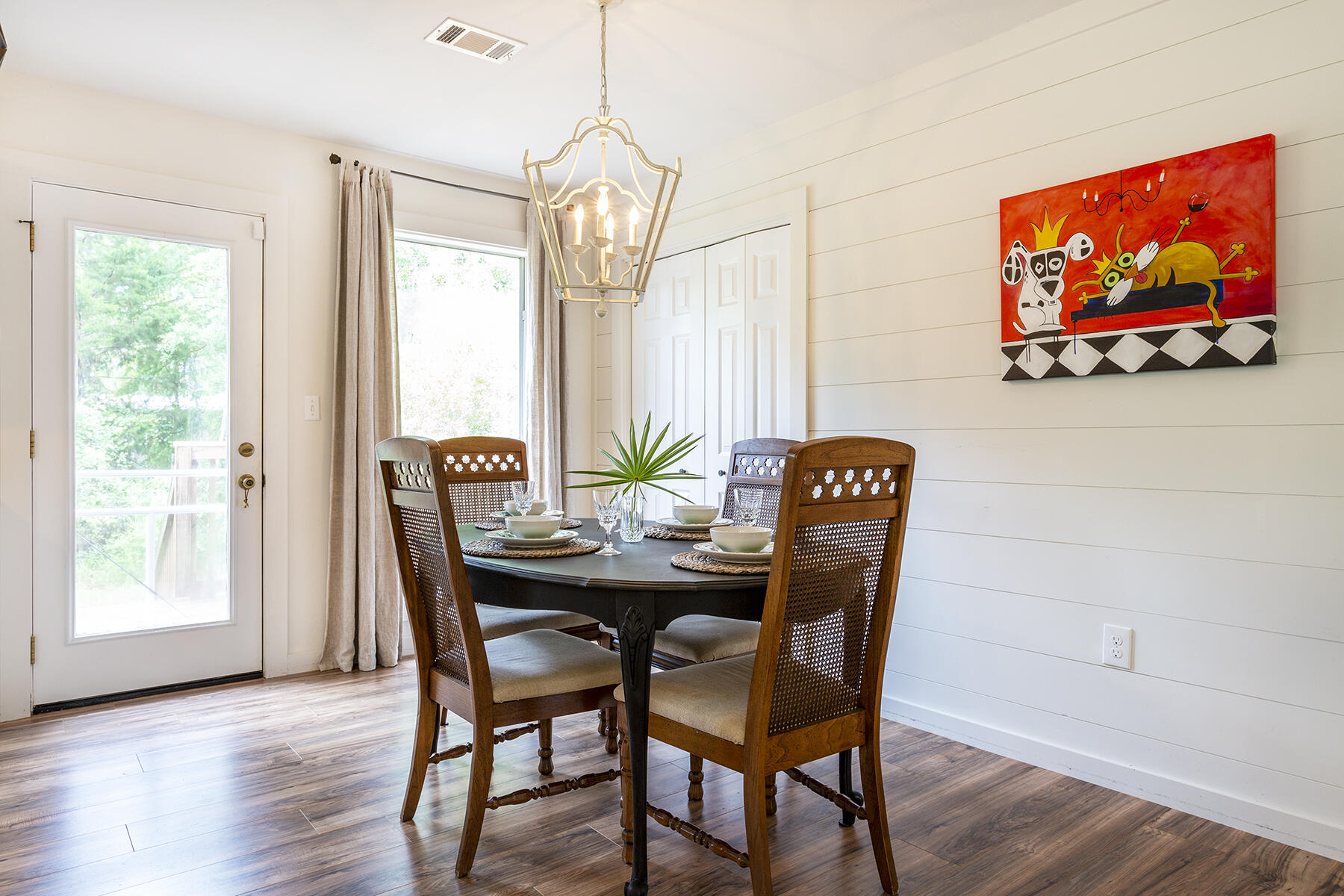 140 East Wild Blueberry Way Santa Rosa Beach, FL 32459 - Photo 12 of 48 a view of a dining room with furniture wooden floor and a chandelier