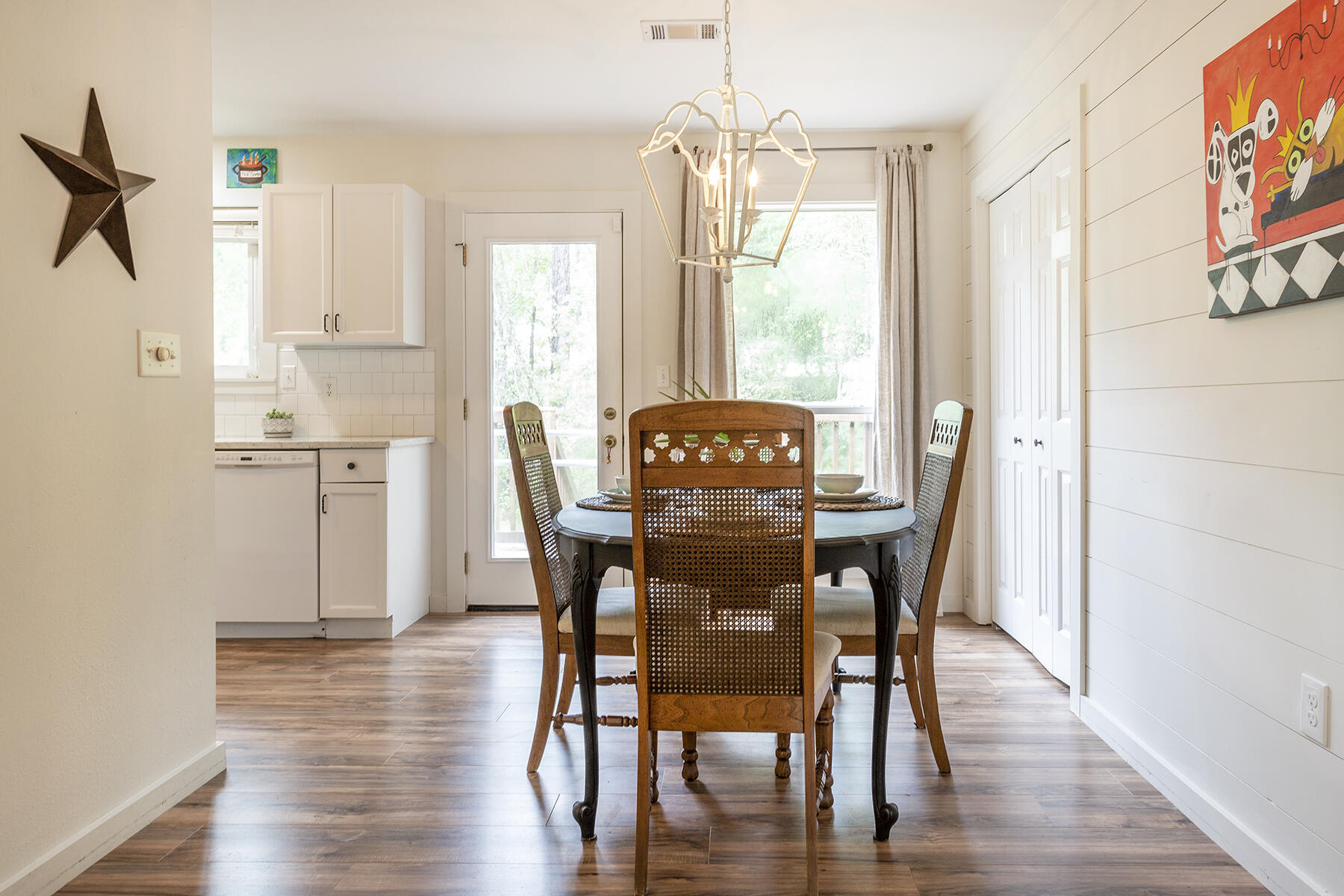 140 East Wild Blueberry Way Santa Rosa Beach, FL 32459 - Photo 13 of 48 a view of a dining room with furniture window and wooden floor