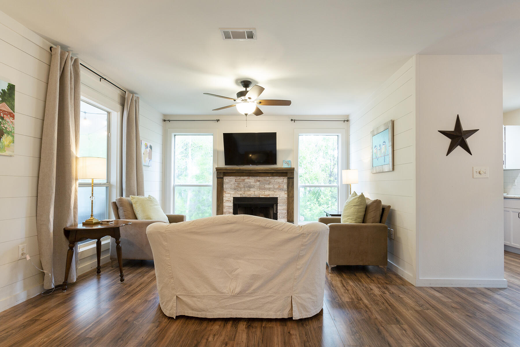 140 East Wild Blueberry Way Santa Rosa Beach, FL 32459 - Photo 15 of 48 a living room with furniture and a fireplace