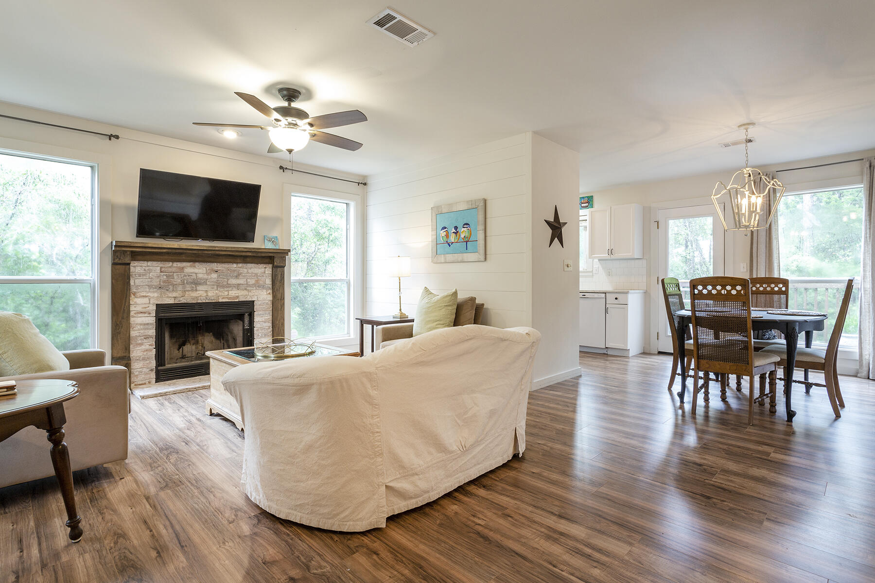 140 East Wild Blueberry Way Santa Rosa Beach, FL 32459 - Photo 2 of 48 a living room with furniture fireplace and flat screen tv