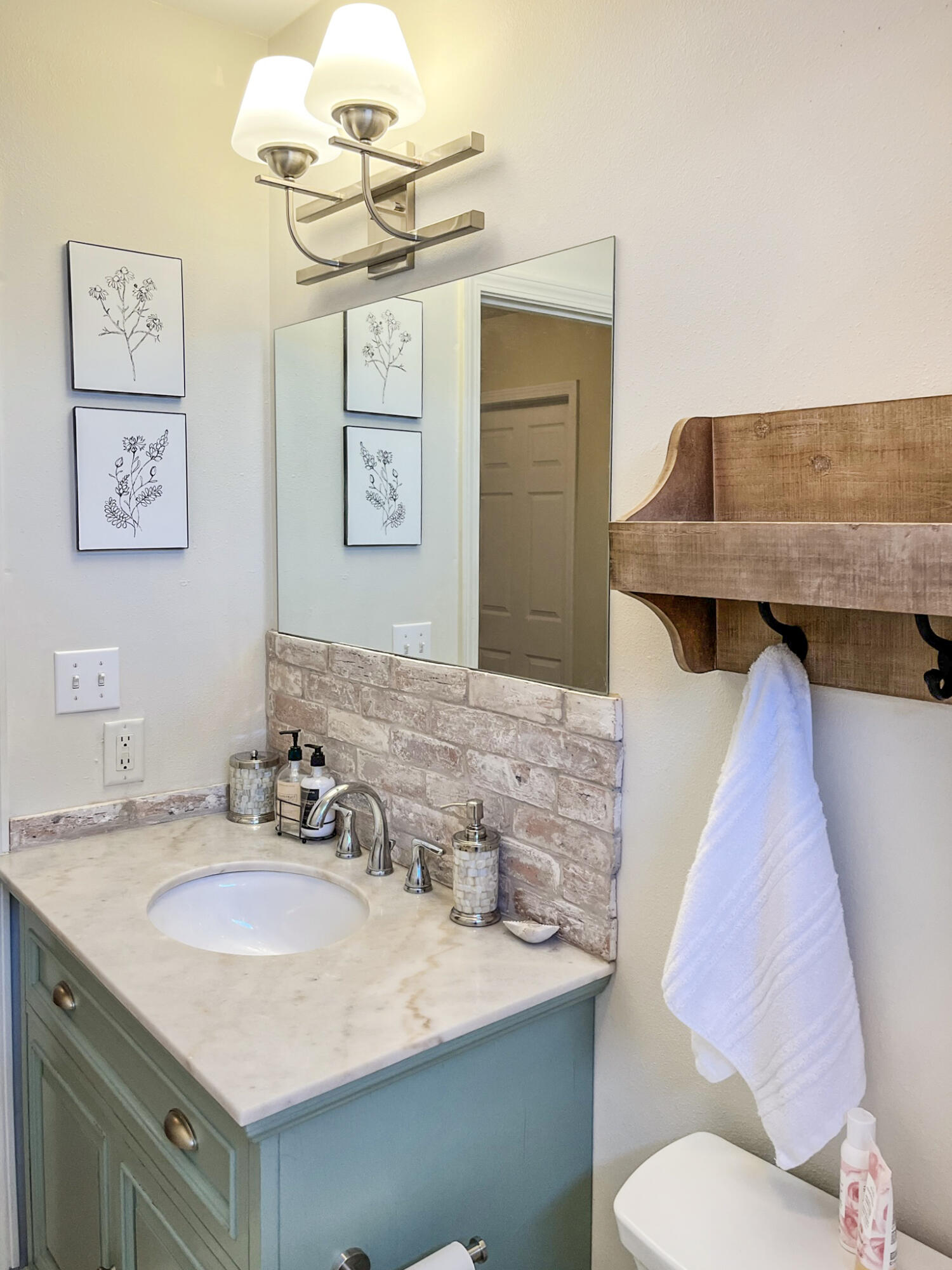 140 East Wild Blueberry Way Santa Rosa Beach, FL 32459 - Photo 36 of 48 a bathroom with a sink and a mirror