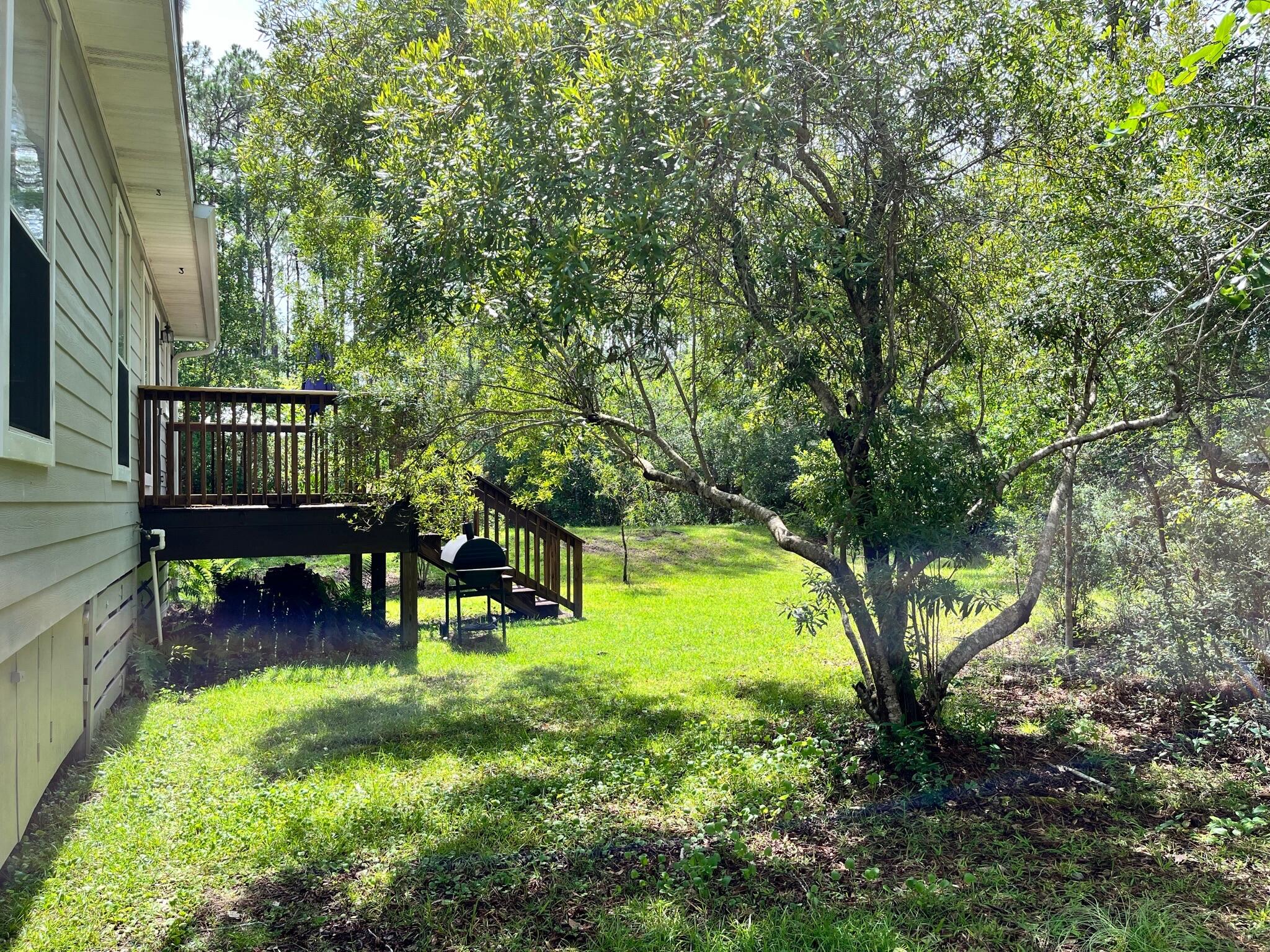 140 East Wild Blueberry Way Santa Rosa Beach, FL 32459 - Photo 5 of 48 a view of swimming pool with lawn chairs and a fire pit