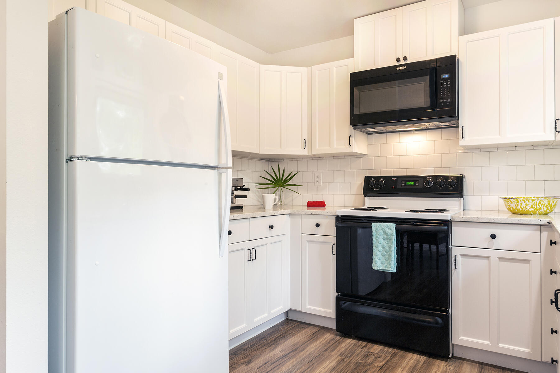 140 East Wild Blueberry Way Santa Rosa Beach, FL 32459 - Photo 9 of 48 a kitchen with stainless steel appliances white cabinets and a refrigerator