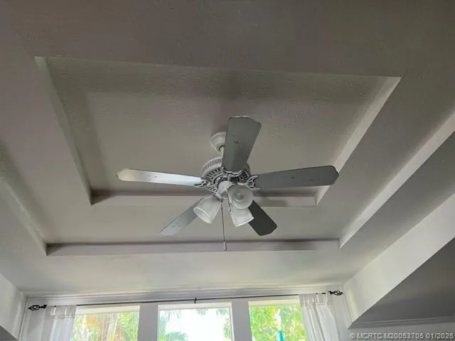 a white toilet sitting next to a shower curtain
