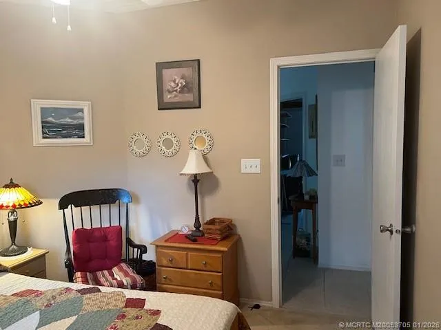 a bathroom with a granite countertop sink toilet a mirror a vanity and shower
